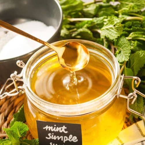 mint infused simple syrup - freshly made mint with spoon