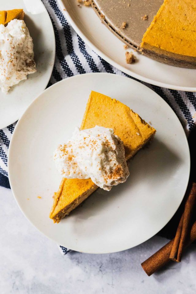 keto pumpkin treat - top view of a slice of cheese cake with whipping cream