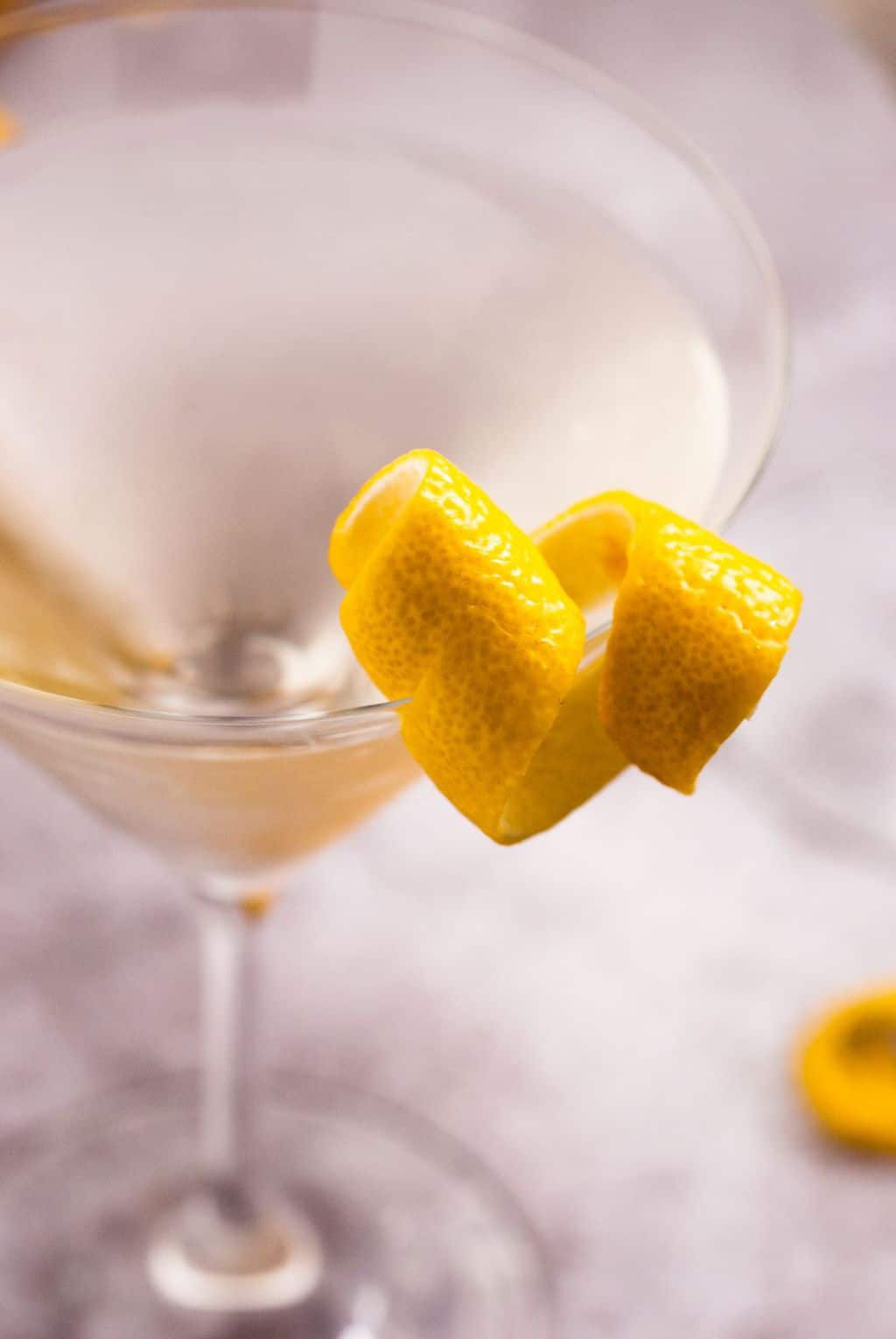how do you make a martini - a close up shot of the lemon garnish
