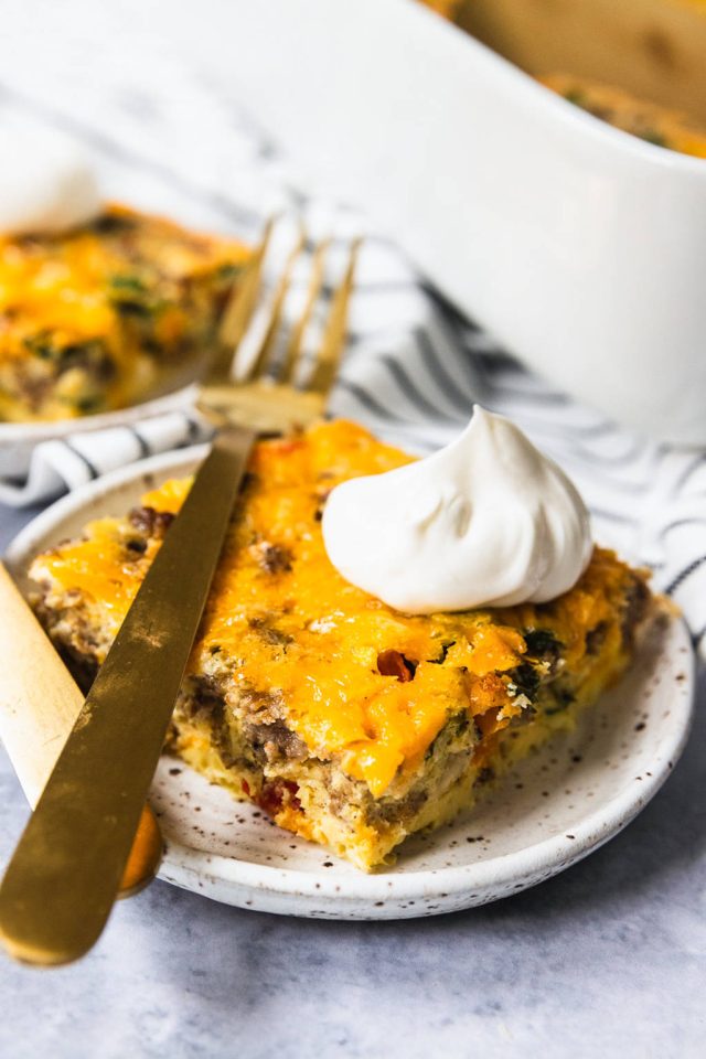 breakfast casserole with sour cream on top