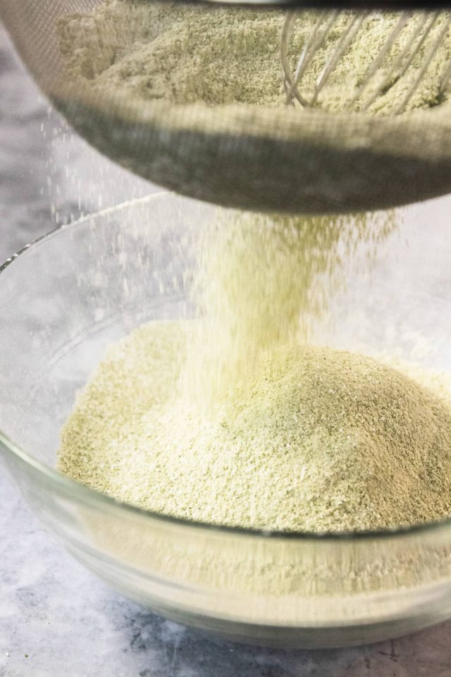 sifting the sugar, flour and matcha in a bowl