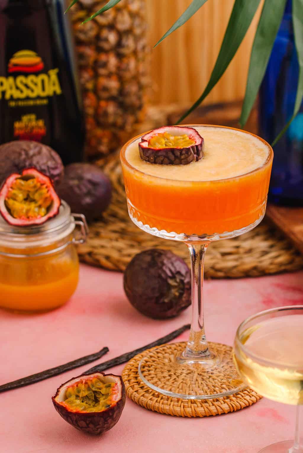 passionfruit martini garnished with half passion fruit