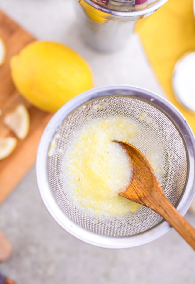 straining the lemon juice - easy shots to make by Ashley Rose of sugar & cloth