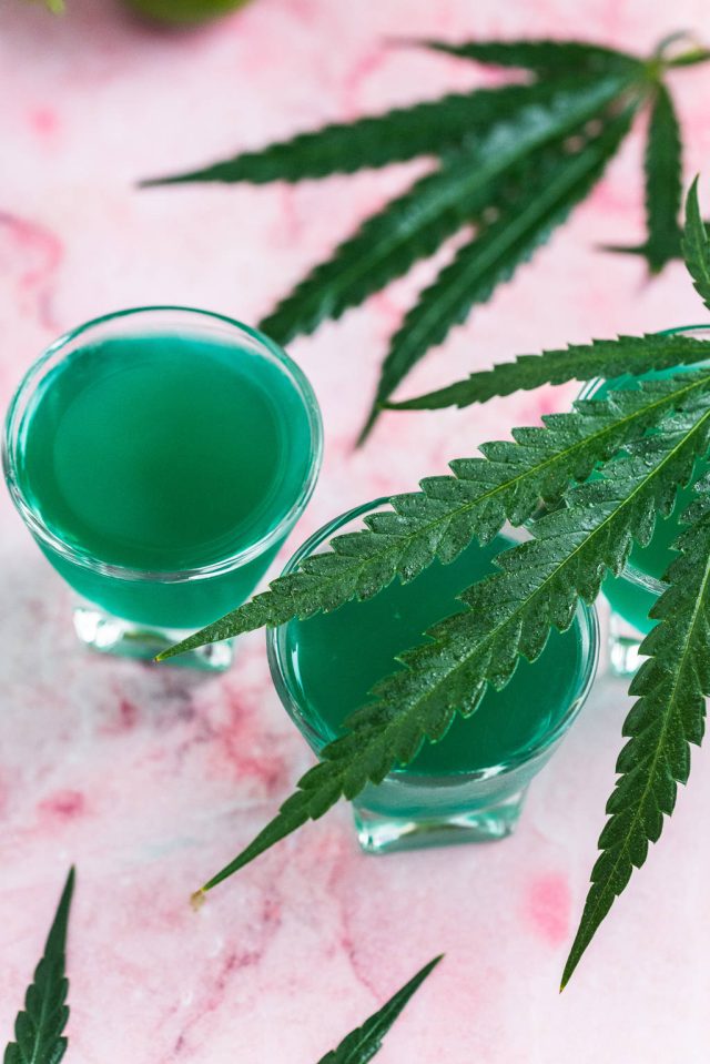 top view of the Liquid Marijuana shots with marijuana leaves on the side