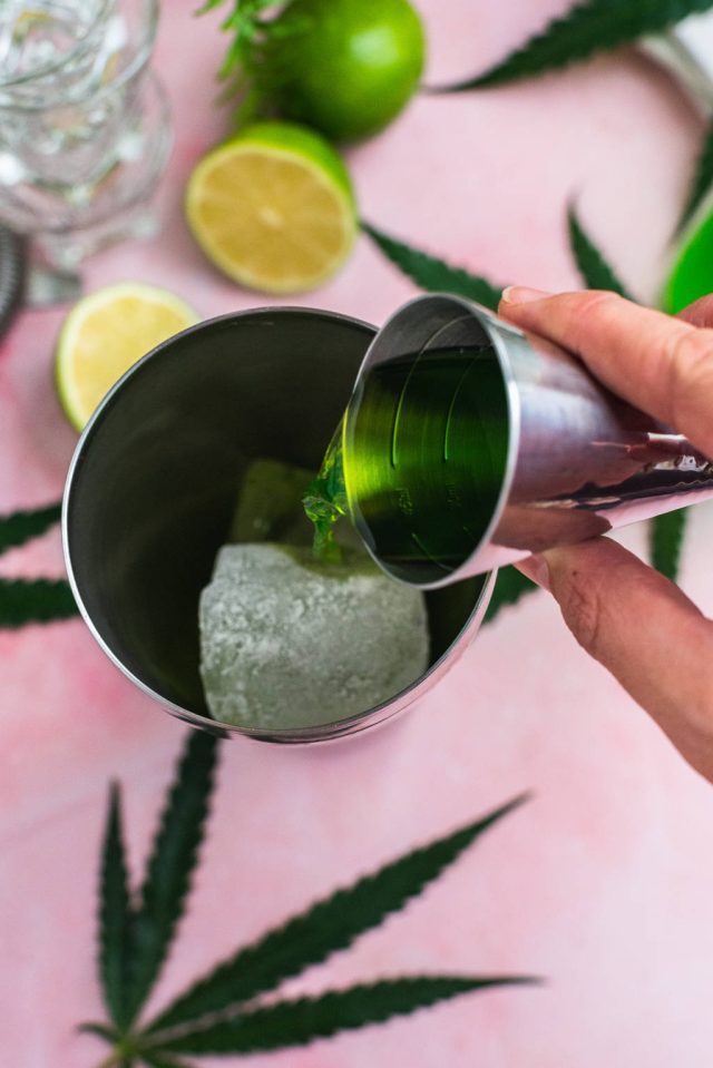 adding ingredients to a cocktail shaker for the Liquid Marijuana