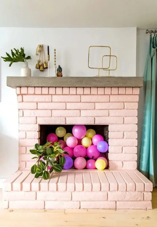 Style Colorful Balloons in an empty fireplace