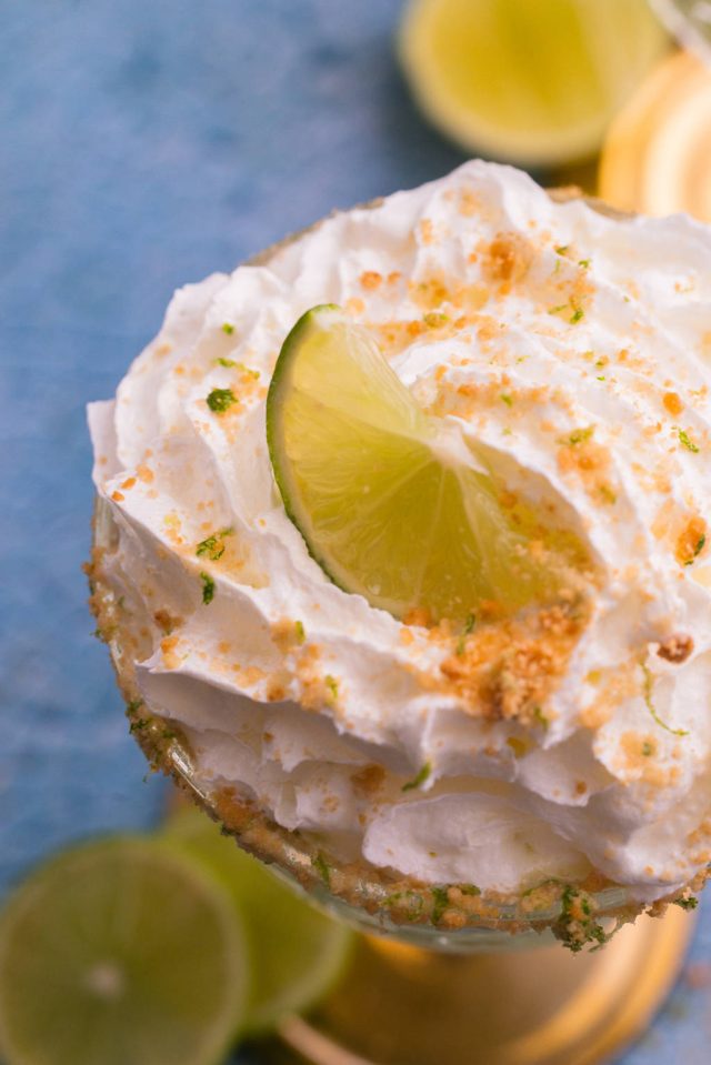 top view of a Key lime martini with cream garnish