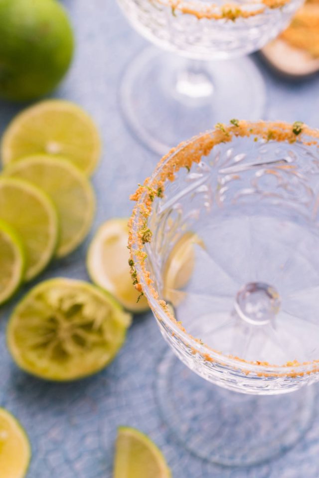 a glass dipped into the cracker and lime zest mixture