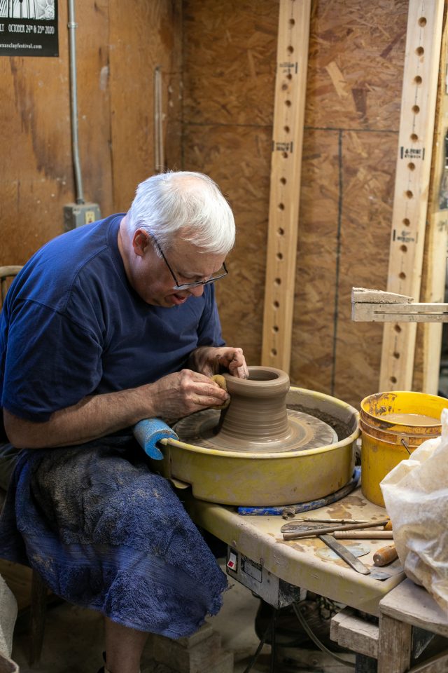 photo of an artist working at the Barn Pottery Shop for boutiques in New Braunfels by Sugar & Cloth