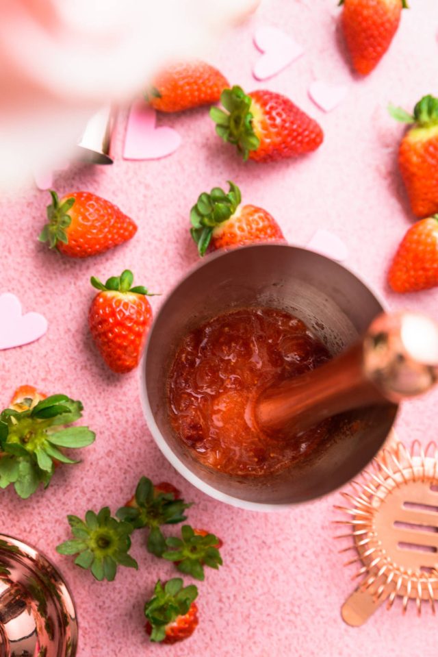 Muddling the strawberries with the muddler