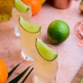 three glasses of Cactus cooler shot with lemon lime garnish