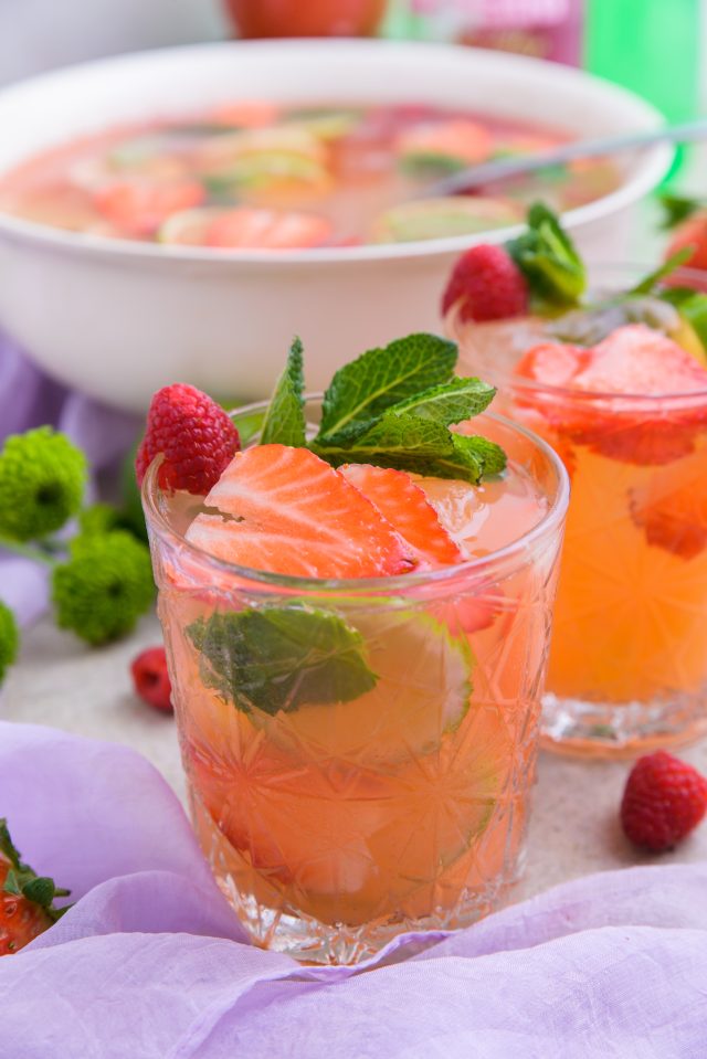 a refreshing Easter Punch served with mint and berry garnishes by Ashley Rose of Sugar & Cloth