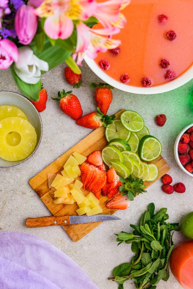 pineapple, strawberries, lime and mint garnishes for a fruity punch by Ashley Rose of Sugar & Cloth