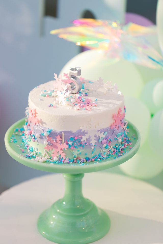 how we spruced up a store bought cake to turn it into a Frozen birthday cake by Sugar & Cloth