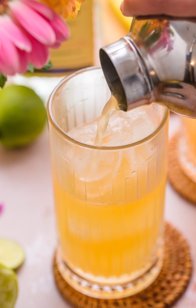 strain the gin and juice mixture into a tall glass 