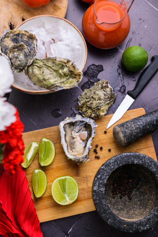 When you feel the hinge start to give, apply a bit more pressure and use a twisting motion to pop the hinge open. Be careful not to push the knife too far into the oyster; you want to keep the oyster intact.